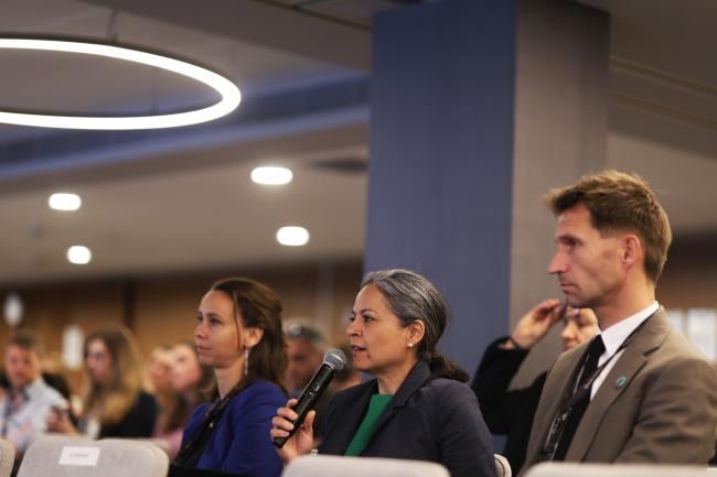 A participant poses a question to the panel