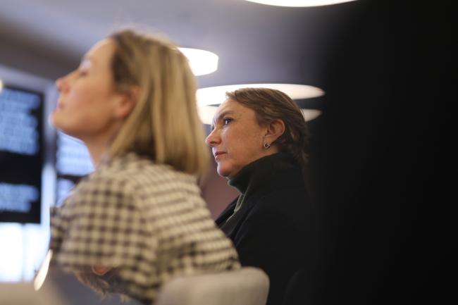 Participants listen to panelists