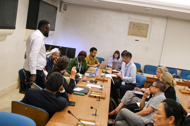 Participants continue the discussions in breakout groups 
