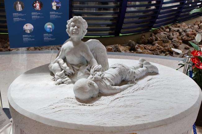 La Morte e il Pianto, a sculpture by Luigi Prevedel commemorating Aylan Kurdi, the three-year-old Syrian boy who drowned while crossing the Mediterranean Sea in 2015. The sculpture was donated to FAO by Pope Francis in 2017. 