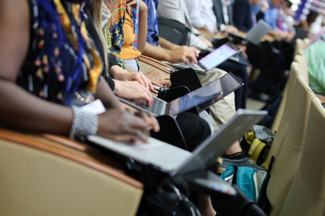 Participants take notes during the session. 