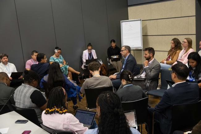 Delegates breakout into groups for in-depth discussions