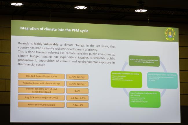 A slide highlights how Rwanda integrates climate change into their financial planning