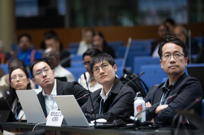 Delegates listen