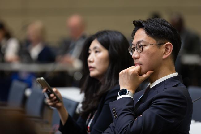 Delegates listen