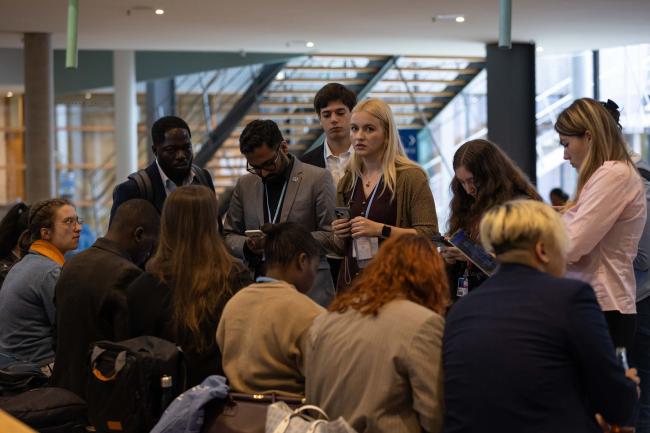 Youth delegates meet informally at the start of the day