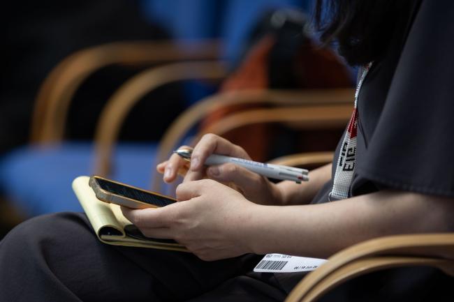 Delegates take notes