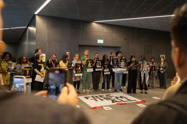 Members of civil society raise awareness about the plight of environmental defenders, calling to 'free them all'