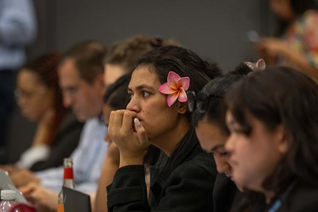 Delegates follow the discussion during informal consultations