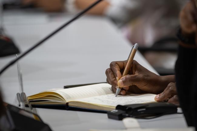 Delegate takes notes