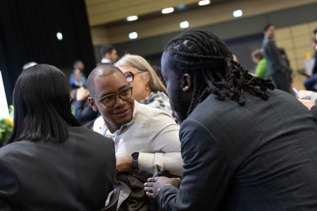 Delegates from Antigua and Barbuda consult