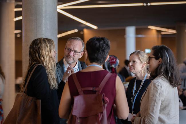 Gonzalo Muñoz, former High Level Climate Action Champion, speaks with friends