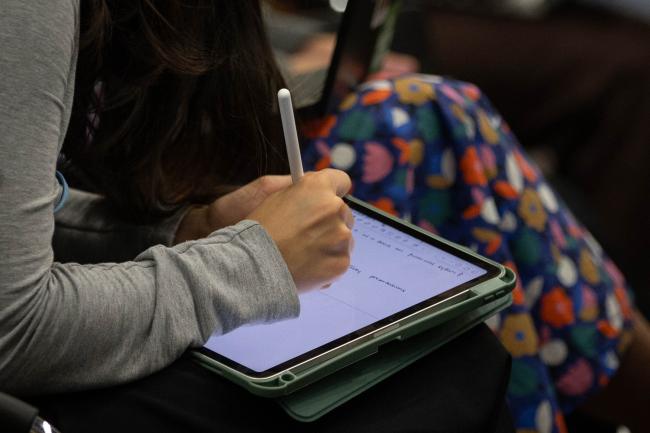 Delegate takes notes