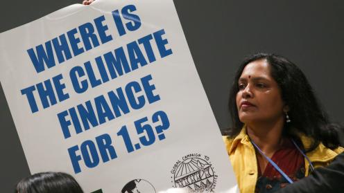 As discussions on finance began, members of civil society demonstrate in the corridors, calling for stronger financial mechanisms to effectively combat the climate crisis. 