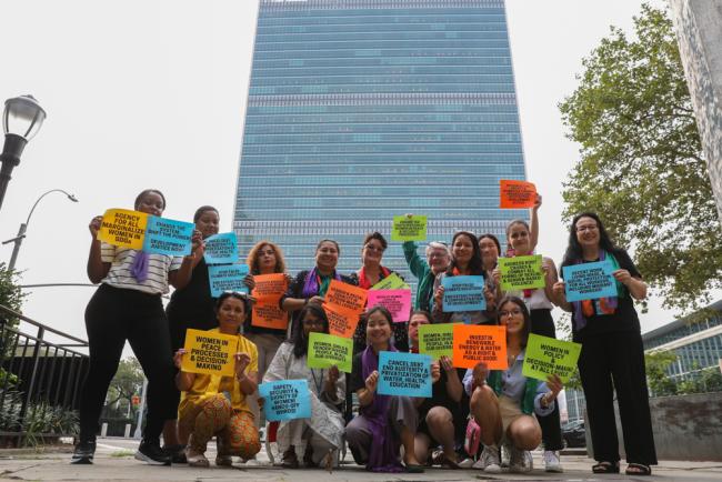 On the penultimate day of HLPF 2023, representatives of the Women's Major Group gather outside UN Headquarters to call for the promotion of women's rights